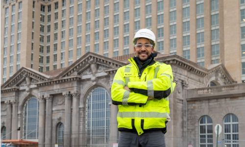 Manuel Martinez standing in front of the Train Station